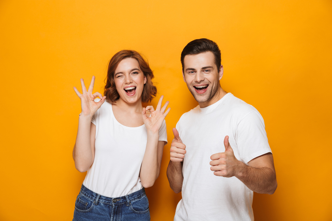 Couple Showing OK Hand Signs